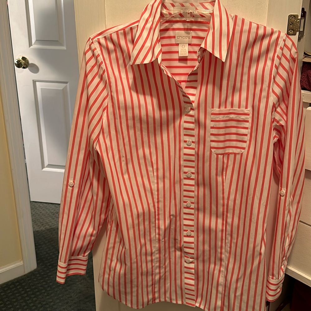 Pink and white blouse by Chico’s.
